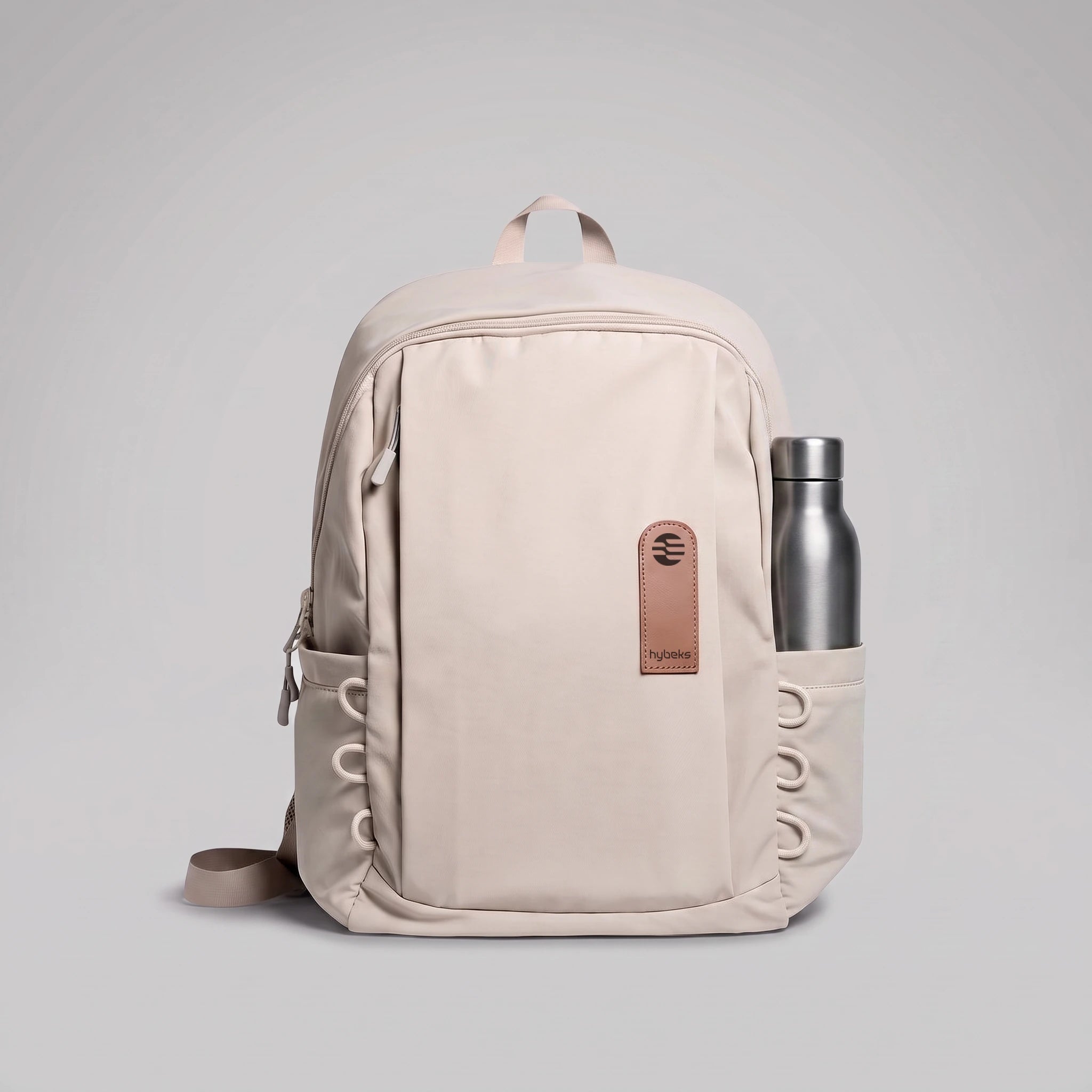 hybeks Drift Backpack in Morning Fog, side pocket holding a water bottle.