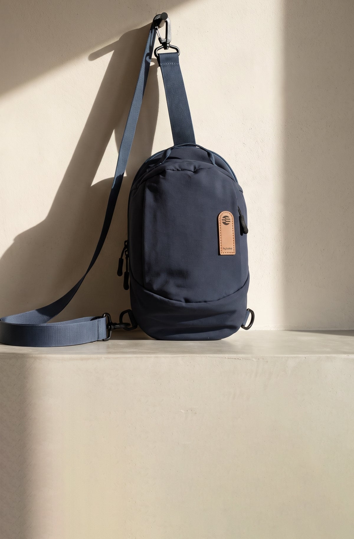 hybeks Drift Sling in Midnight Transit, the 3.4 litre water-repellent nylon crossbody sling bag.